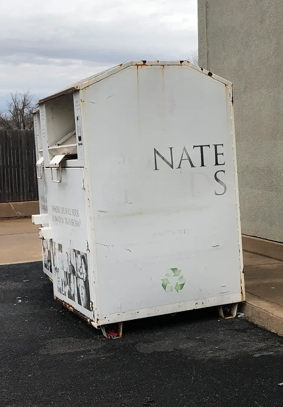 Donation bin with text faded to only show NATE S