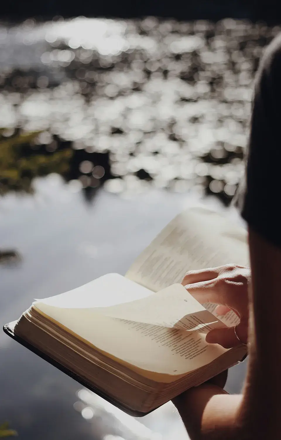 Person holding open Bible