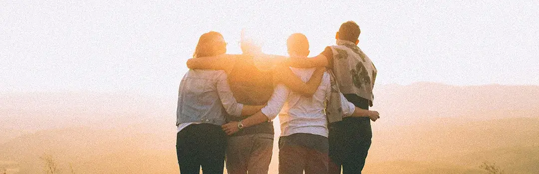 Friends standing outside together