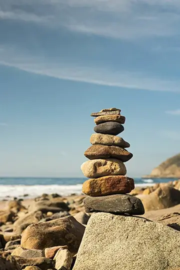 Stacked rocks near lake