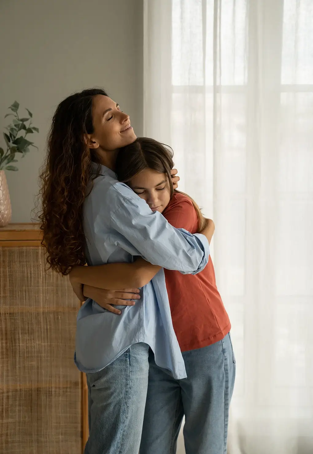 Mother and daughter embracing